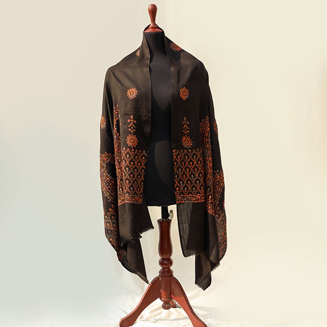 Black hand embroidered Kashmiri Pashmina wool shawl; Detailed subtle pink-rust-orange threadwork on high quality Cashmere wool; Full length