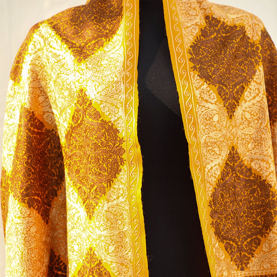 Mustard pashmina wool shawl with brown and beige patterned machine embroidery; Recurring diamond shaped patterns across the entire shawl; pu