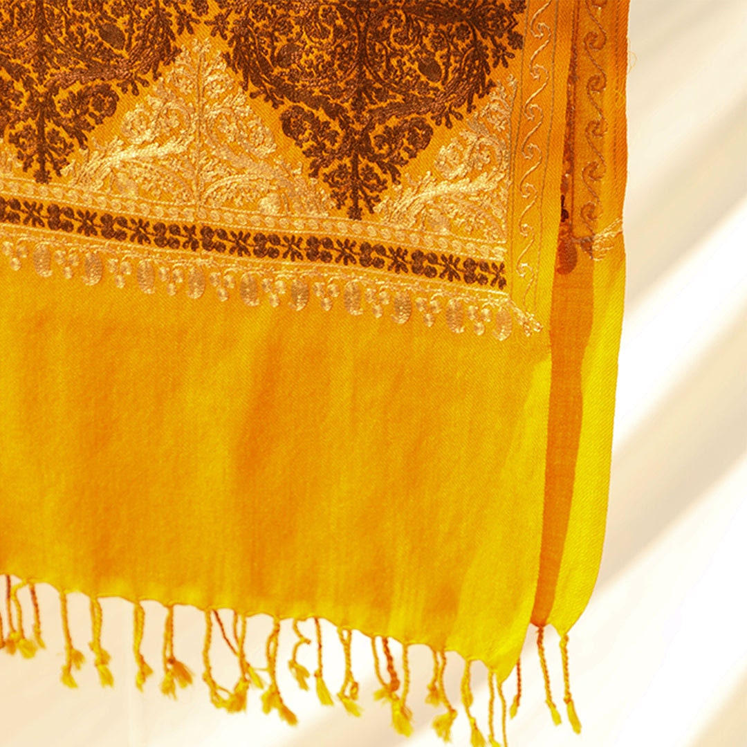 Mustard pashmina wool shawl with brown and beige patterned machine embroidery; Recurring diamond shaped patterns across the entire shawl; pu