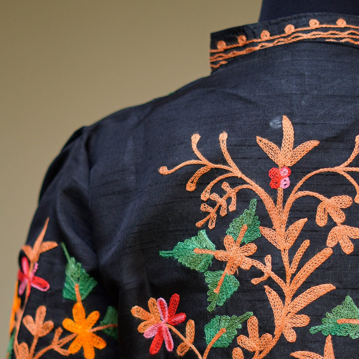 Black base color raw silk embroidered silk coat; Detailed multi colored embroidery; Stylish and comfortable