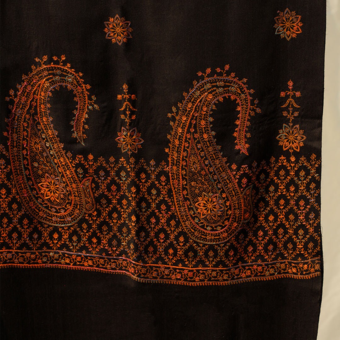 Black hand embroidered Kashmiri Pashmina wool shawl; Detailed subtle pink-rust-orange threadwork on high quality Cashmere wool; Full length