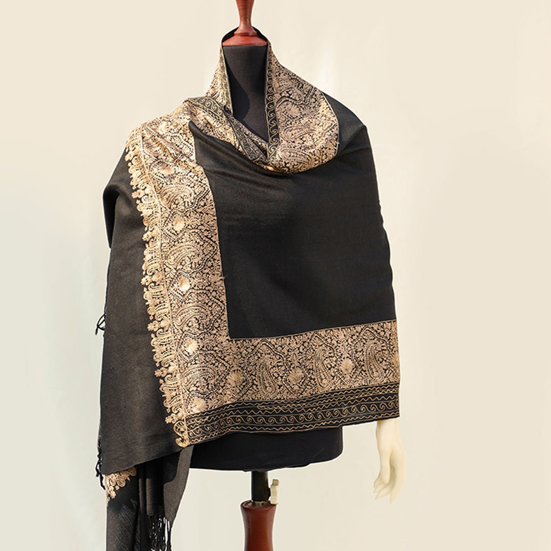 High quality pashmina wool shawl in Black pure wool base, with extensive border embroidery in golden color; fine machine-work with paisley p