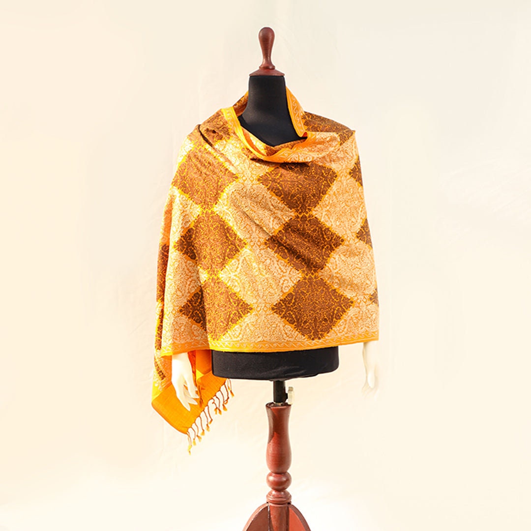 Mustard pashmina wool shawl with brown and beige patterned machine embroidery; Recurring diamond shaped patterns across the entire shawl; pu