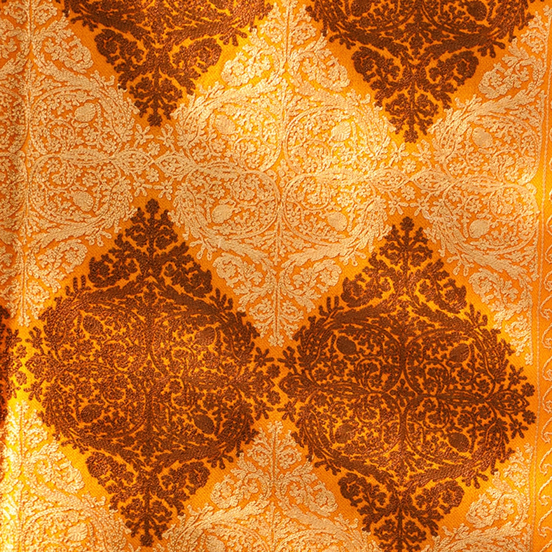 Mustard pashmina wool shawl with brown and beige patterned machine embroidery; Recurring diamond shaped patterns across the entire shawl; pu