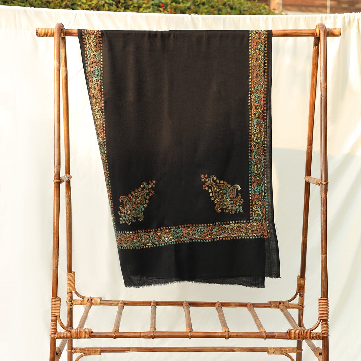 Mustard or Black colored pashmina wool shawl with intricate hand embroidery in subtle yet bold colors with paisley motifs on the border; Pas