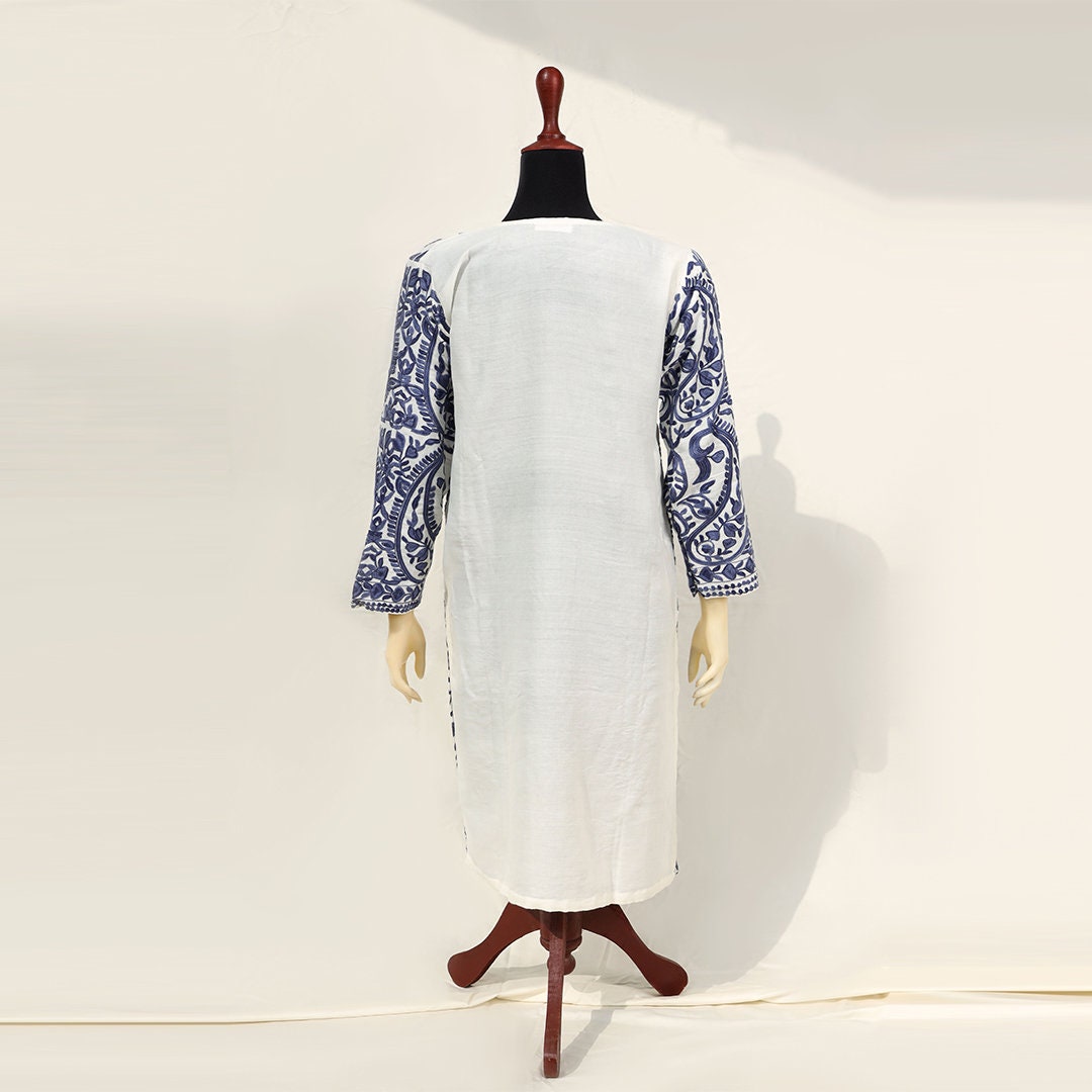 Cream-white blue ethnic kashmiri pheran shirt with side slits and pockets with royal paisley patterns all across the pure wool women shirt